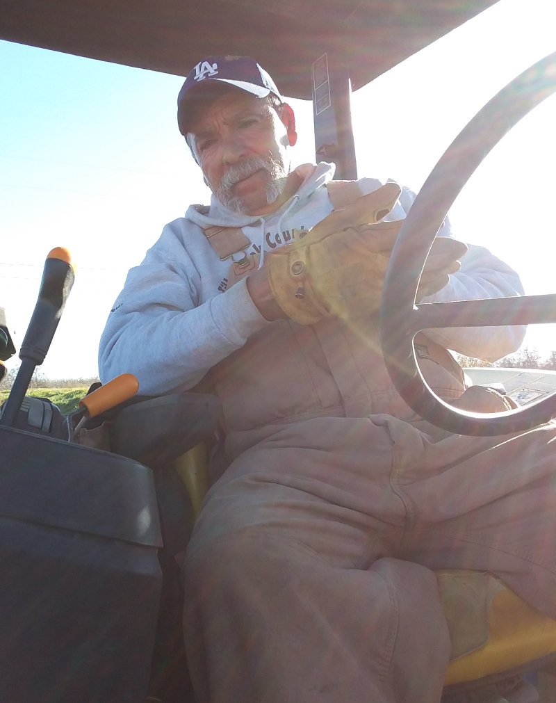 an image of a man sitting in a farming machine